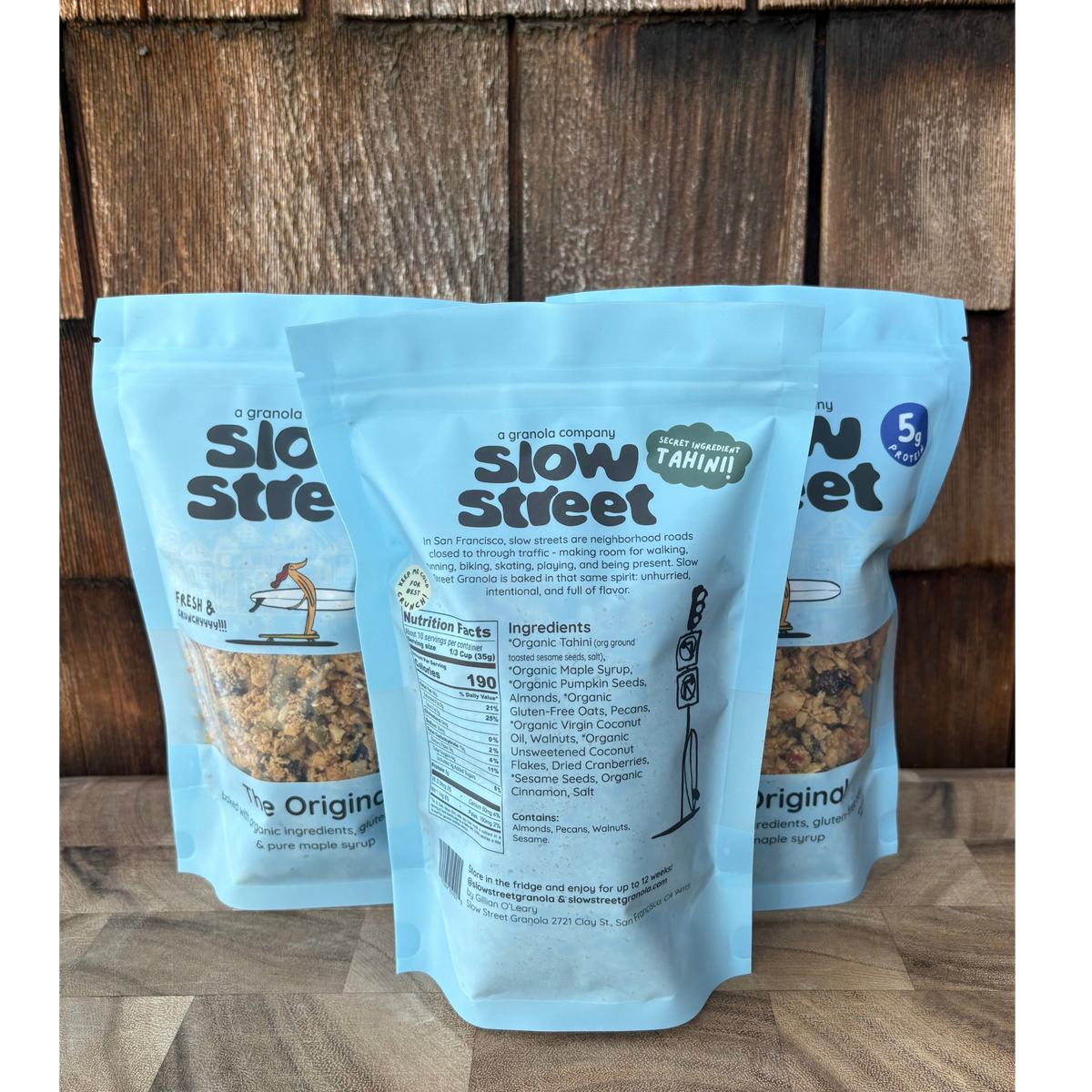 Slow Street Original granola, 3 12 oz (340 g) bags, one showing back with 35 g serving nutrition panel.