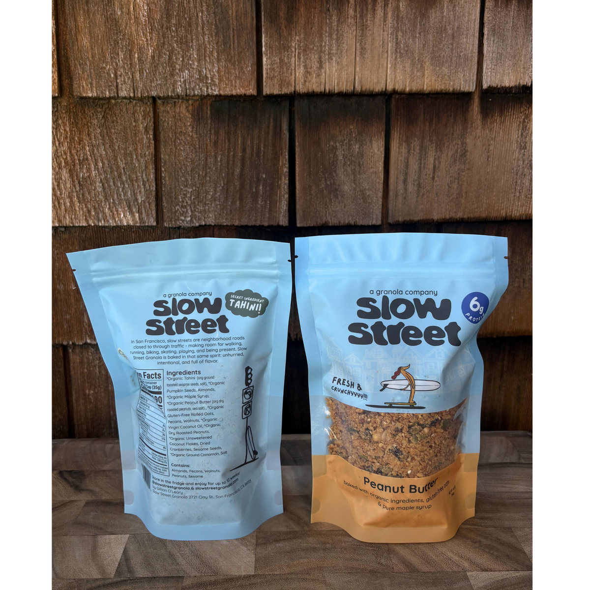 Slow Street peanut butter granola, 2 12 oz (340 g) bags, one showing its back.