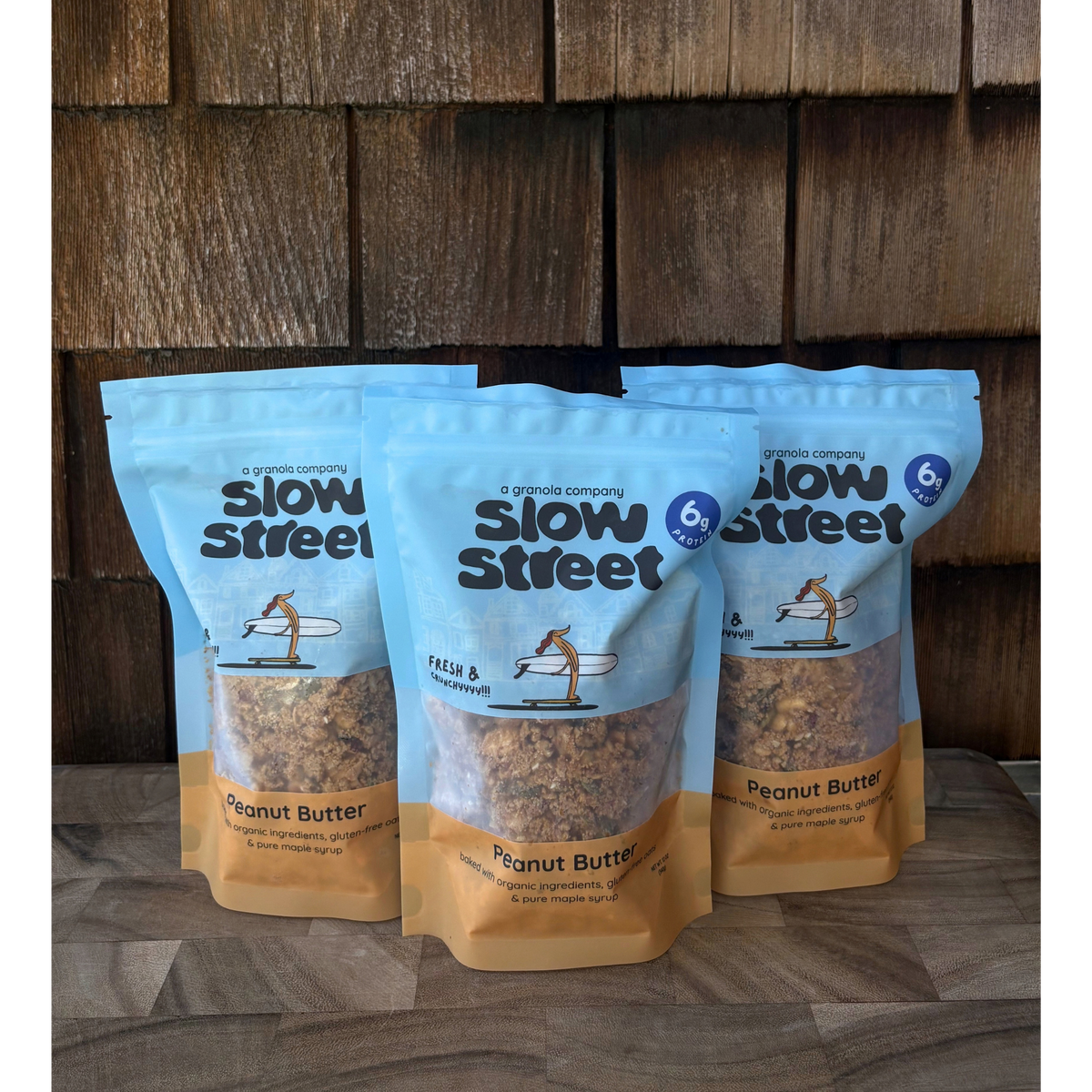 Slow Street peanut butter granola, 3 12 oz (340 g) bags, all facing front.